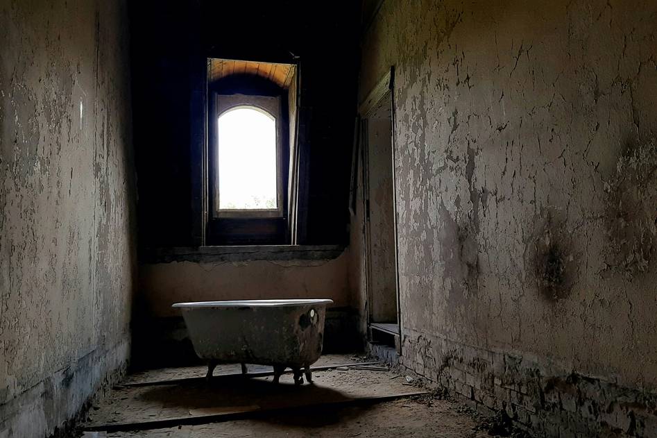 Close-up of a contemporary walk-in bathtub with therapeutic jets and non-slip base